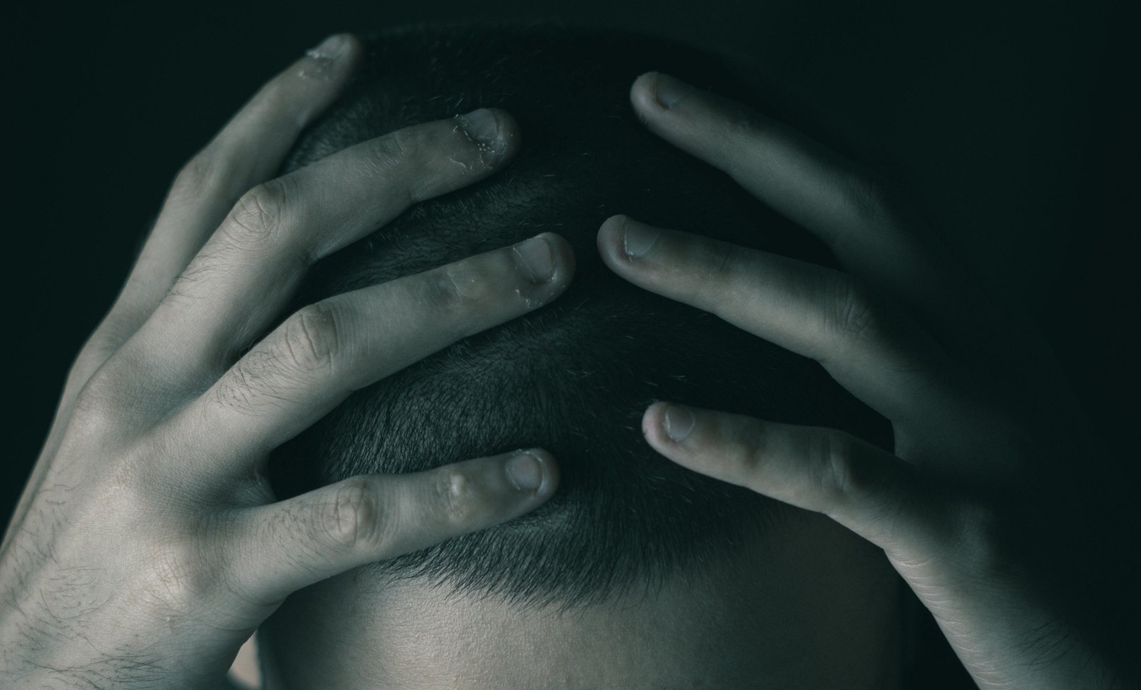Man with hands on head